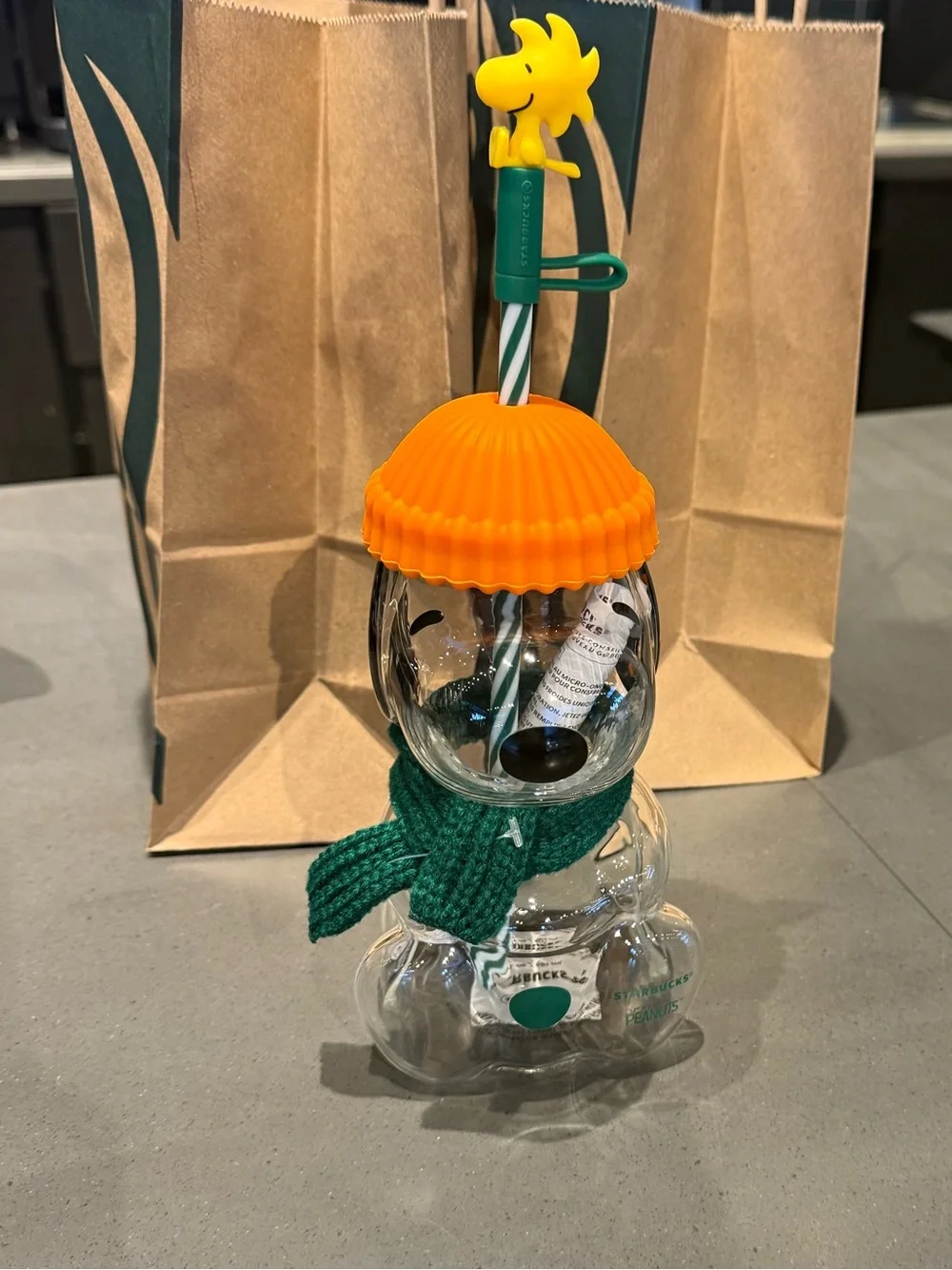 Clear Bear-shaped Drink Cup with Orange Lid and Green Straw